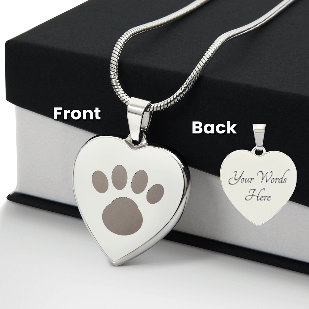 Polished steel heart pendant on a snake chain, paw print on the front and engraving on the back